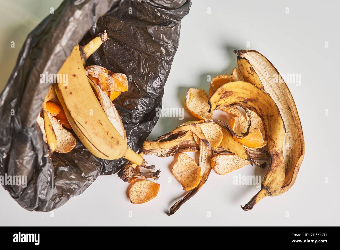 Banana peels in trash can. Using banana peels in compost. Banana skin
