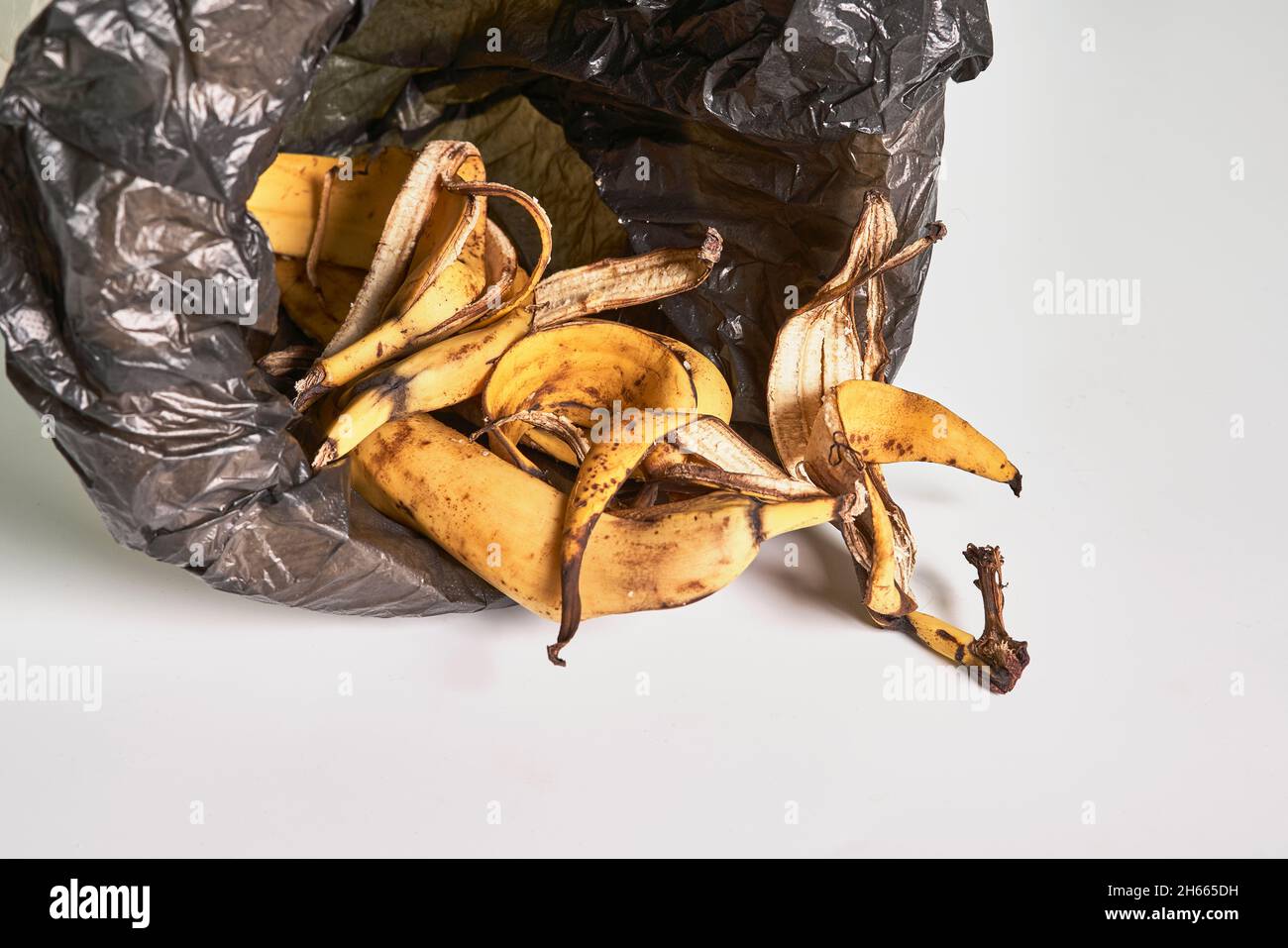 Banana peels in trash can. Using banana peels in compost. Banana skin