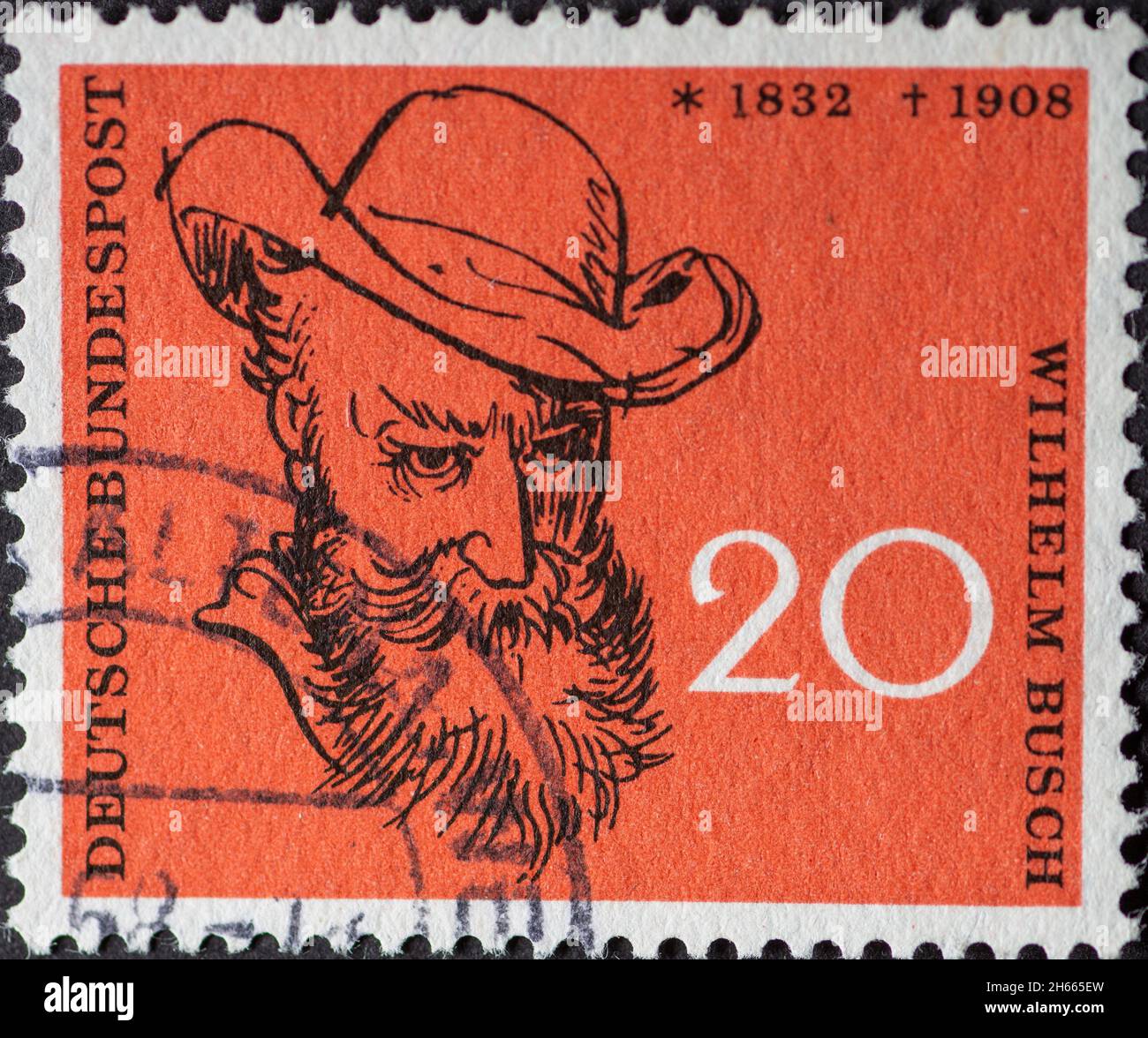 GERMANY - CIRCA 1958: This postage stamp shows the author Wilhelm Busch. The occasion is the 50th anniversary of Wilhelm Busch's death Stock Photo