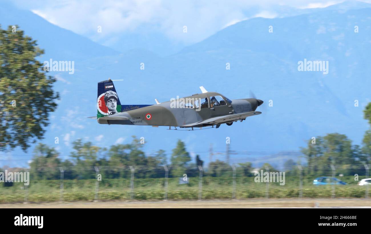 Rivolto , Udine, Italy SEPTEMBER, 17, 2021 Propeller airplane immediately after take-off a few meters from the ground with the landing gear retracted. SIAI Marchetti S.208 of Italian Air Force Stock Photo