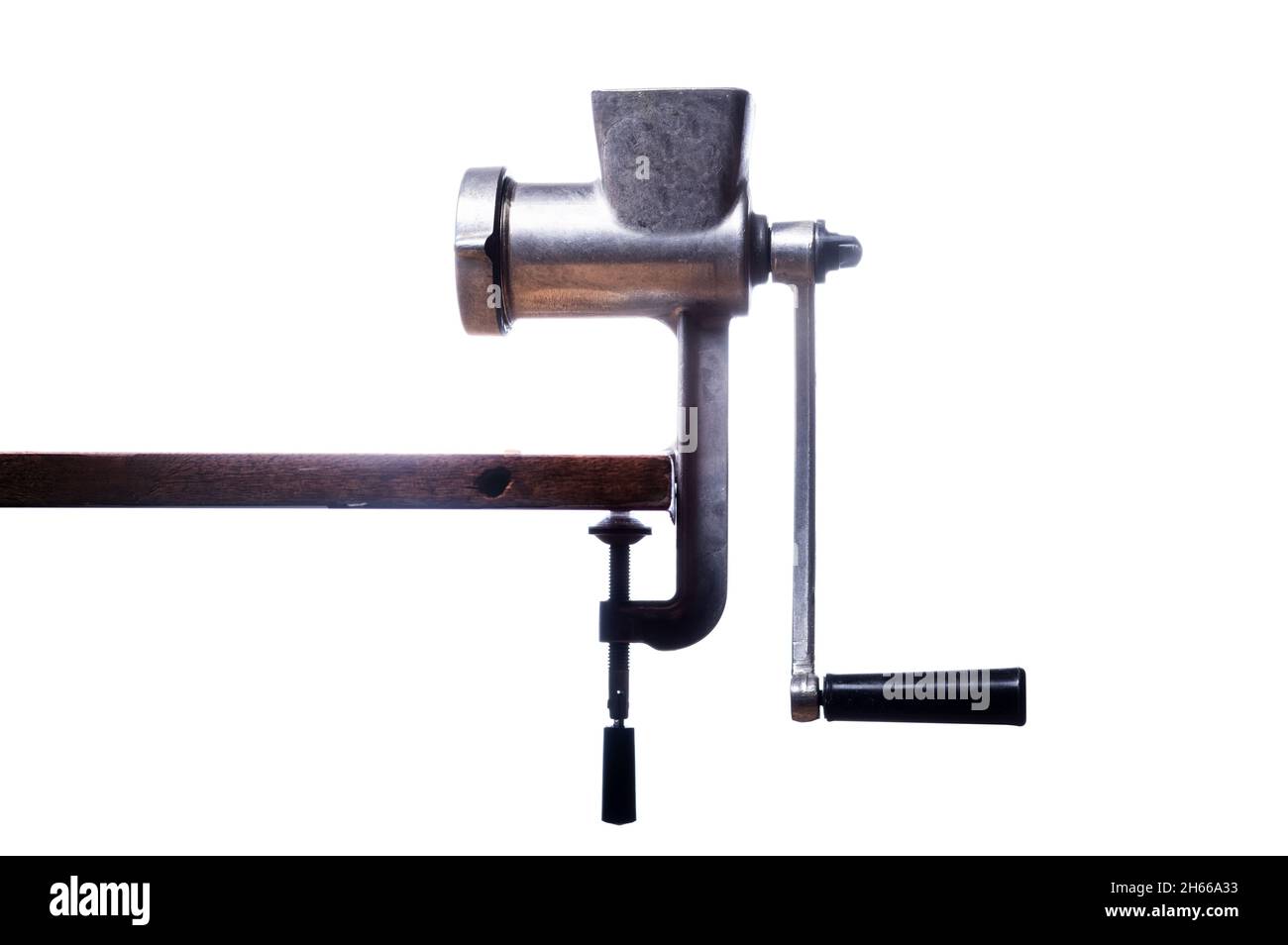 Old iron grinder on a white background. Meat grinder of the Soviet era