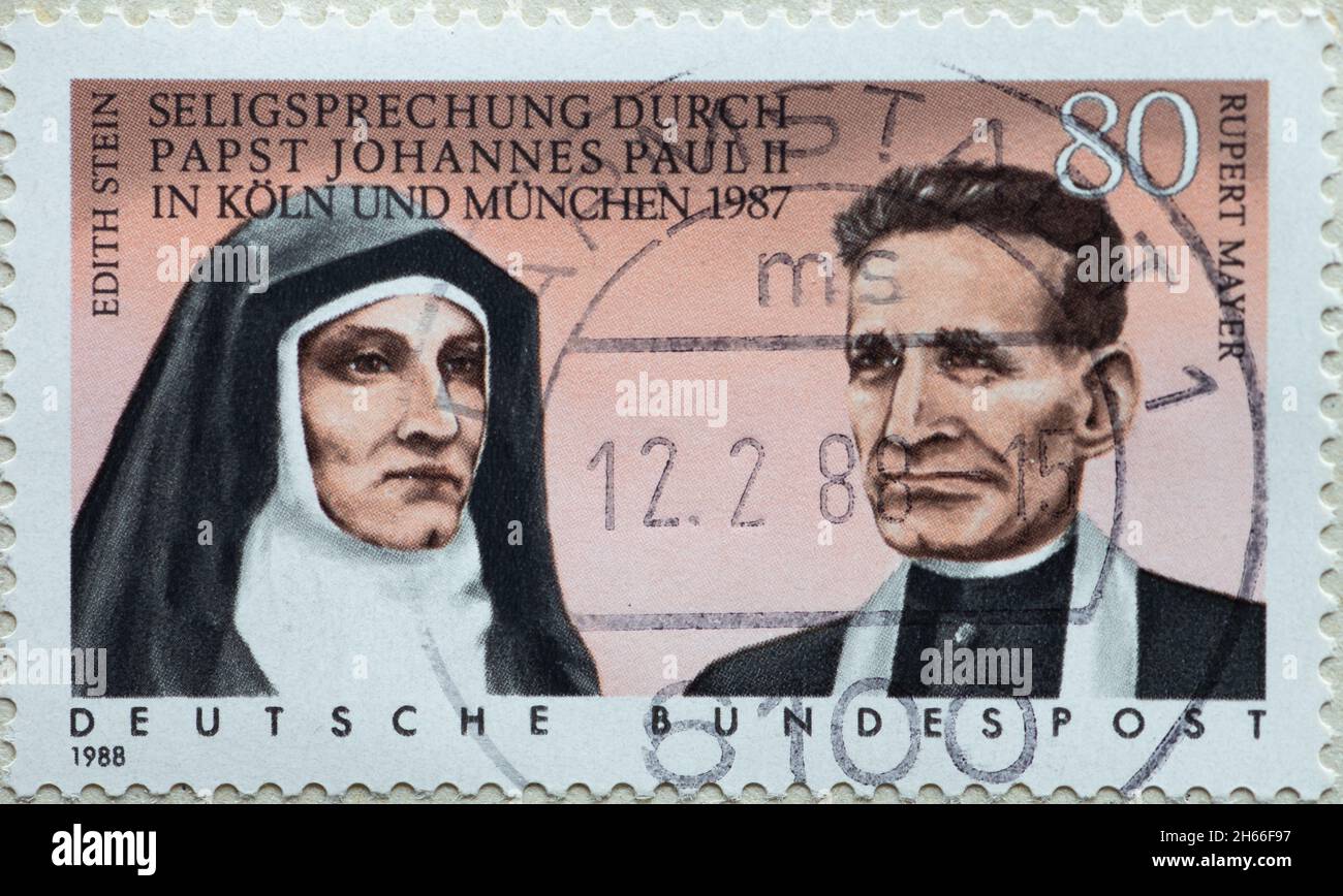 GERMANY - CIRCA 1988: a postage stamp from Germany, showing a portrait of the nun and Carmelite Edith Stein and the German Jesuit Rupert Mayer at the Stock Photo