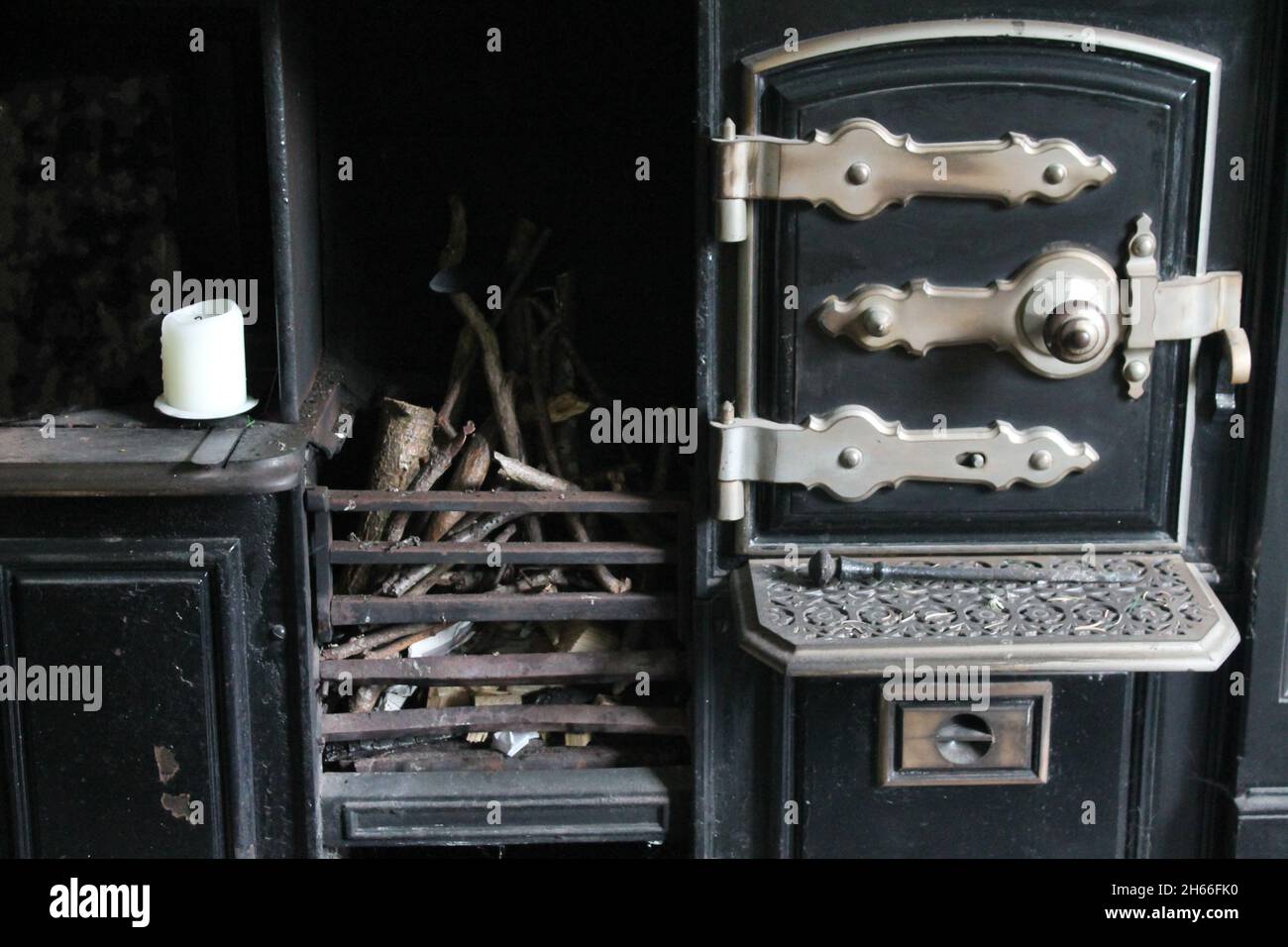 Victorian cooking range in cast iron and brass with wooden in the grate Stock Photo
