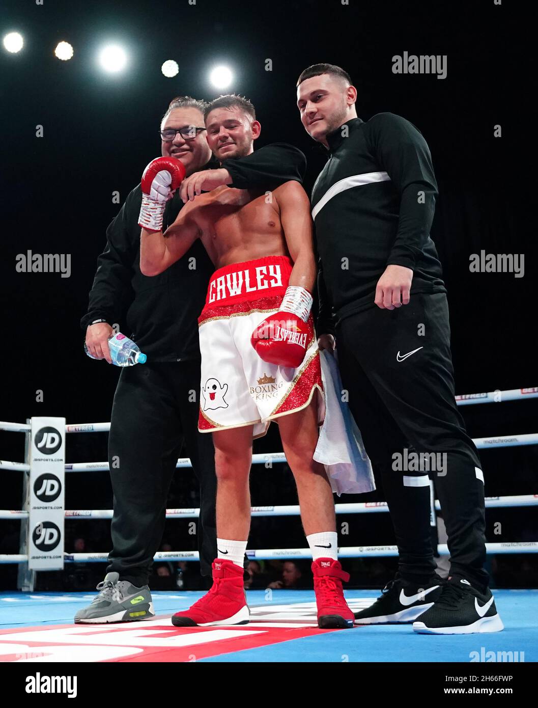 William Cawley (centre) celebrates victory against Stephen Jackson in ...