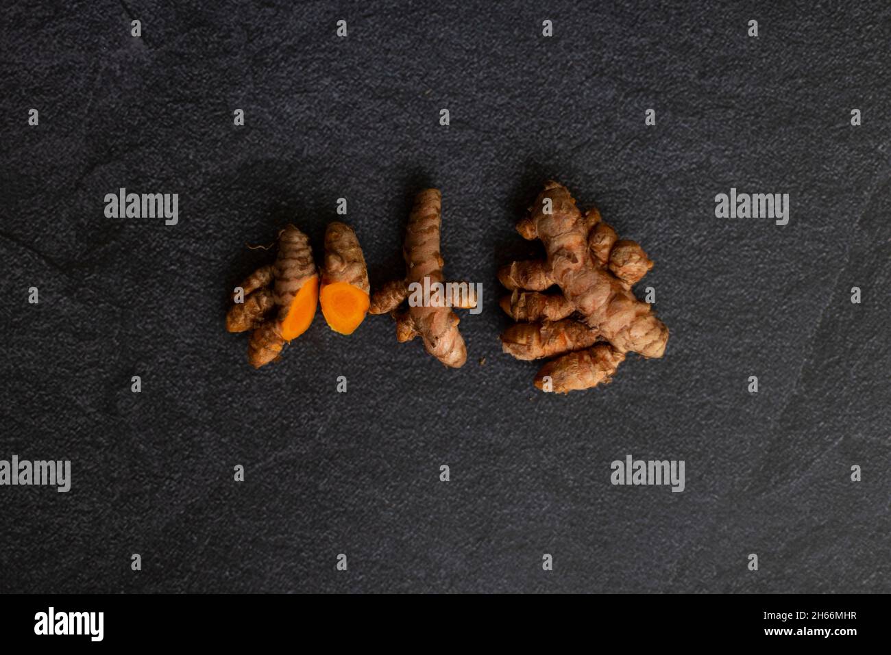 Turmeric Root Powder Under Microscope turmeric in three presentations root laminated and powder on a white ...