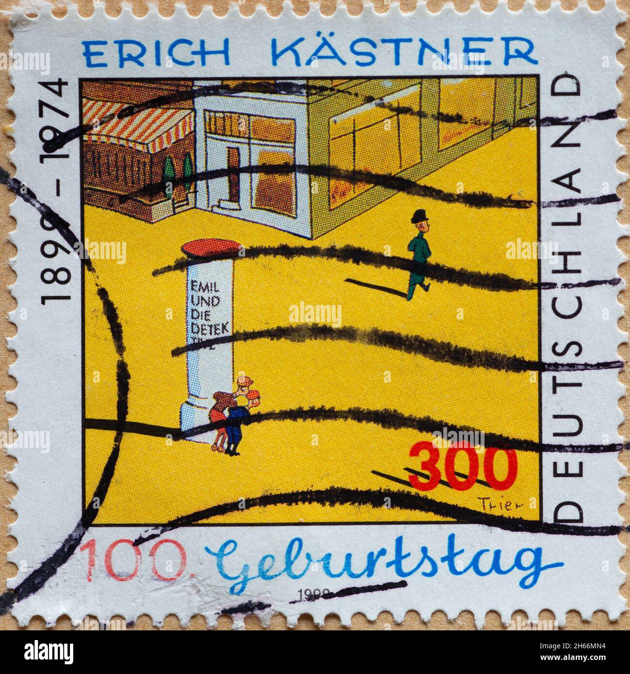 GERMANY - CIRCA 1999 : a postage stamp from Germany, showing a scene from the play 'Emil and the Detective' for the 100th birthday of the poet Erich K Stock Photo
