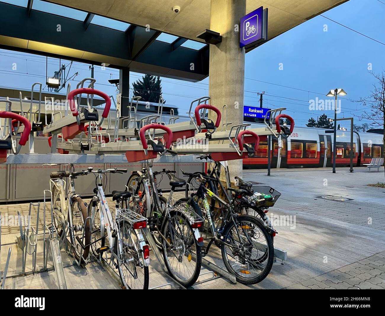 Rankweil, Austria, 13.11.2021. Bicycle parking station at railway station of Rankweil, Vorarlberg. Stock Photo