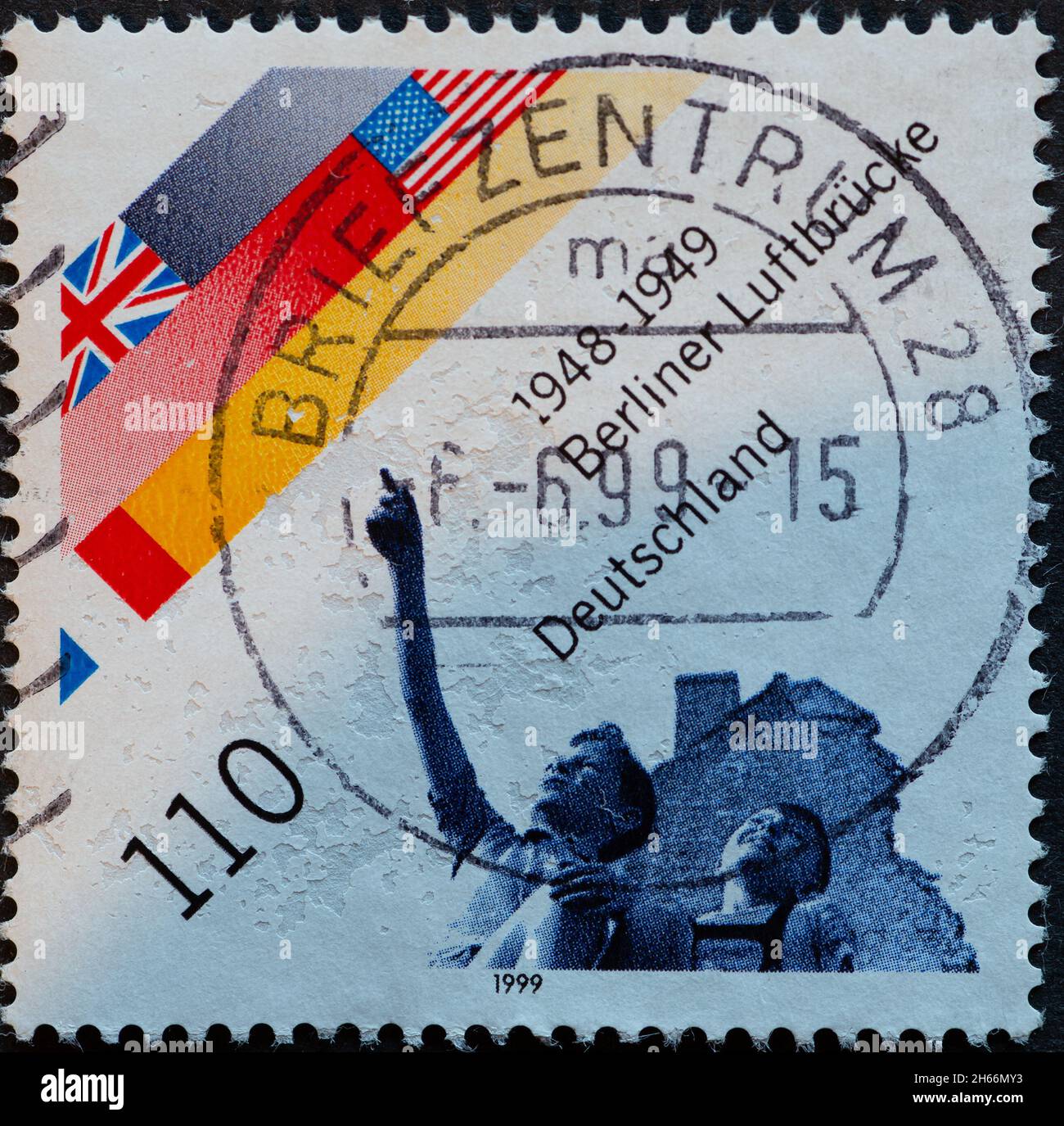 GERMANY - CIRCA 1999 : a postage stamp from Germany, showing the flags of the Allies (US, GB, F) and two boys on the blockade of Berlin by the Soviet Stock Photo