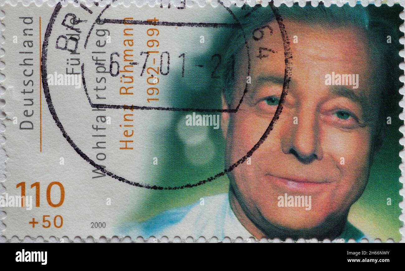 GERMANY - CIRCA 2000: a postage stamp from Germany, showing a portrait of the actor Heinz Rühmann on a charity donation postal stamp Stock Photo