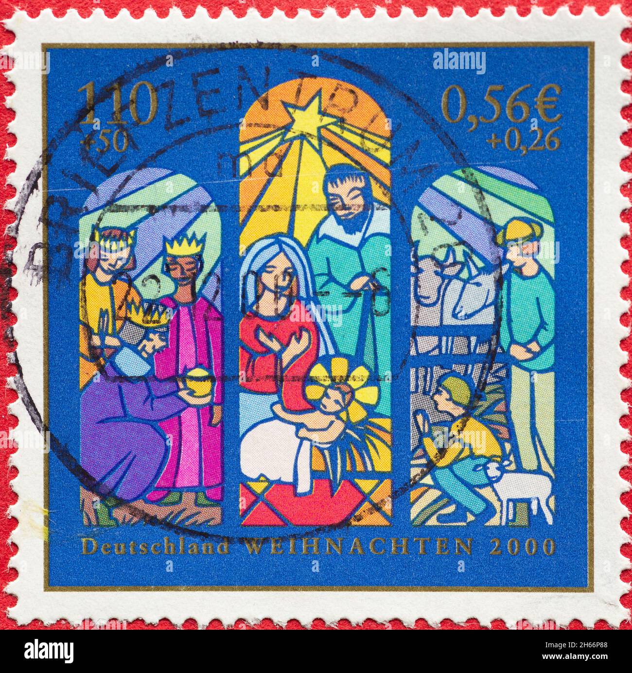 GERMANY - CIRCA 2000: a postage stamp from Germany, showing a window picture with the birth of Christ, the three kings, the shepherds. Christmas posta Stock Photo