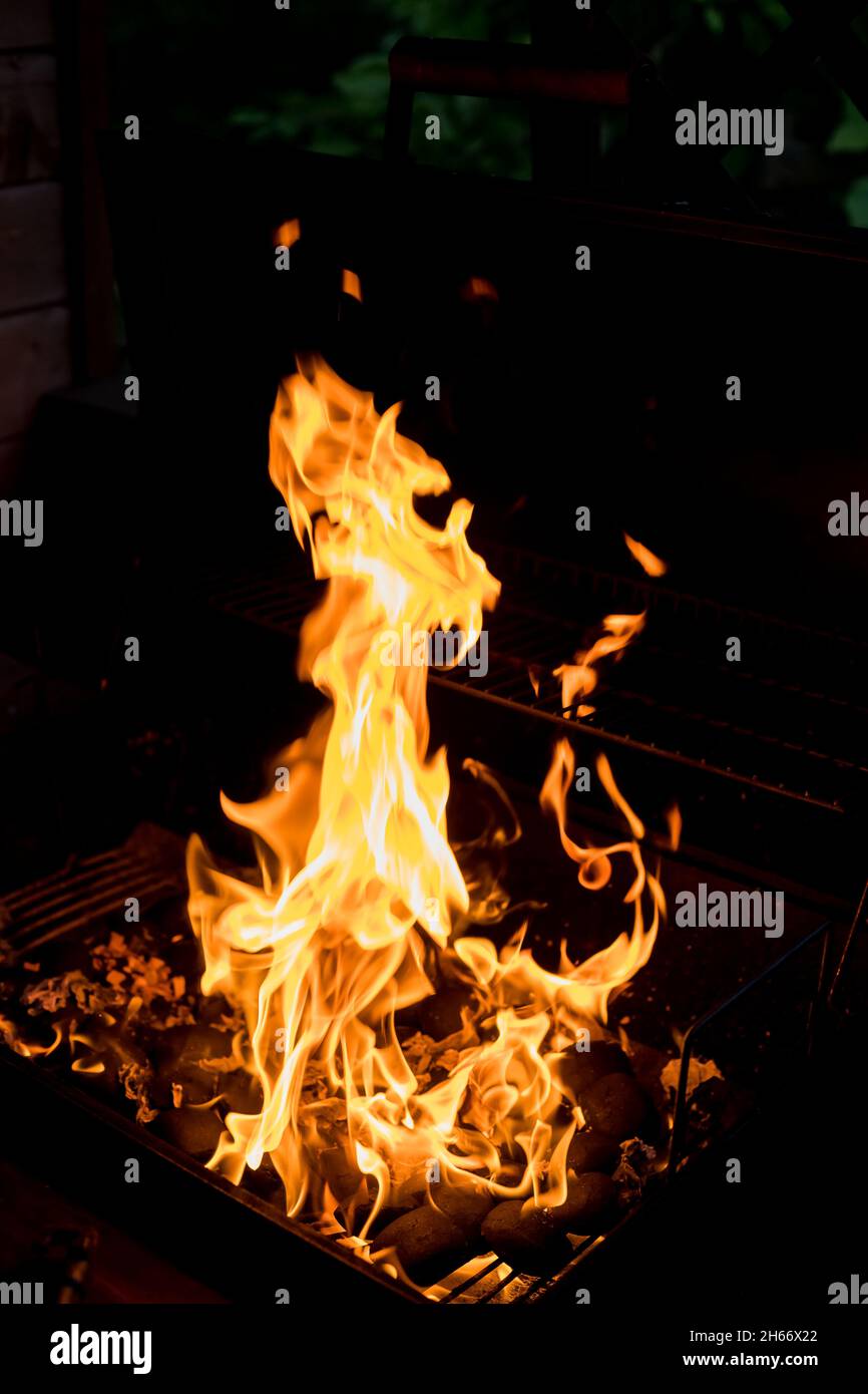 Fire flames with reflection on black background Stock Photo