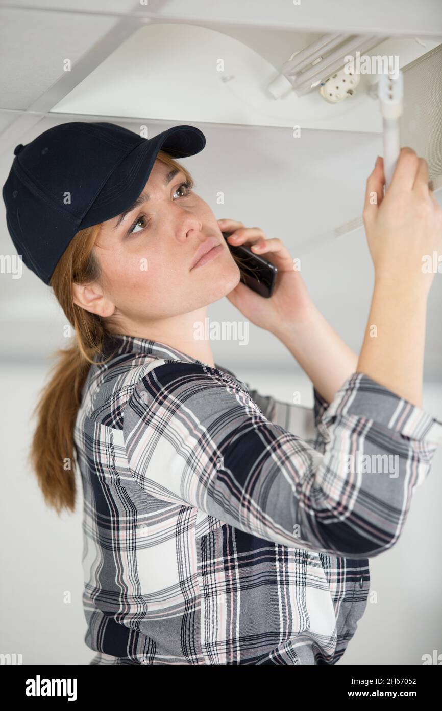 architect at the construction site making a phone call Stock Photo
