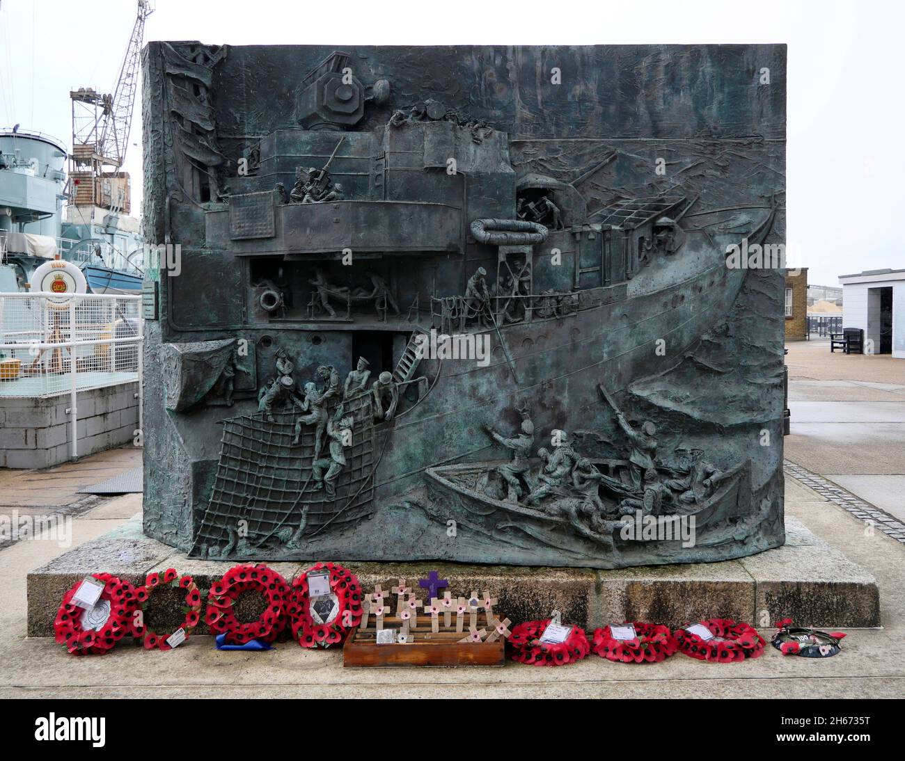 AJAXNETPHOTO. 3RD APRIL, 2019. CHATHAM, ENGLAND. - CHATHAM HISTORIC DOCKYARD - THE NATIONAL DESTROYER MEMORIAL, A BRONZE SCULPTURE SITED ALONGSIDE PRESERVED WW II C CLASS DESTROYER HMS CAVALIER TO THE 11,000 MEN AND 142 ROYAL NAVAL AND ALLIED DESTROYERS LOST DURING BETWEEN 1939-45. VERSO OF THE PLAQUE LISTS NAMES OF THE SHIPS LOST; SIDE FACING CAMERA DEPICTS SAILORS BEING PLUCKED FROM THE SEA BY A DESTROYER.PHOTO:JONATHAN EASTLAND/AJAX REF:GX8 190304 158 Stock Photo