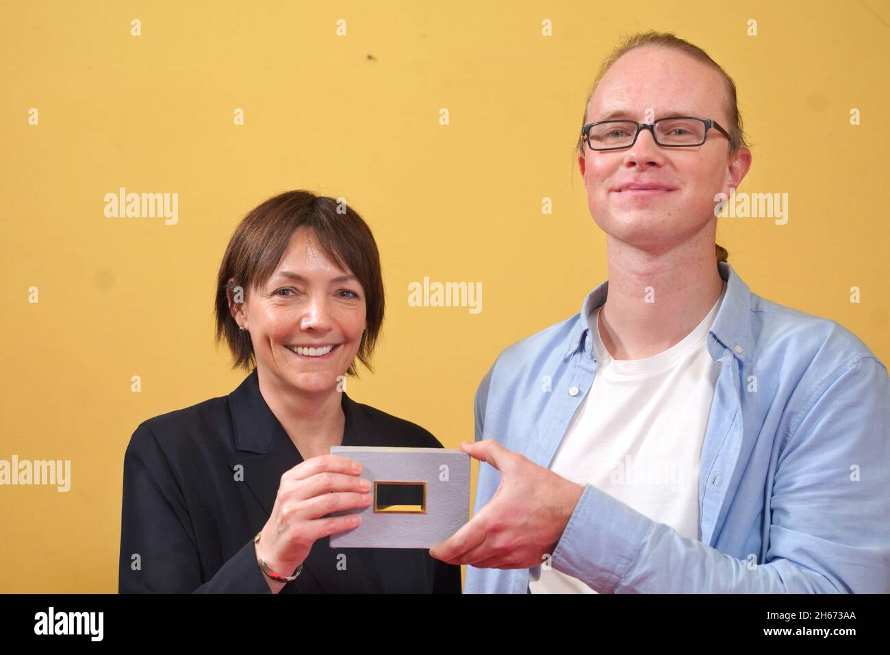Berlin, Germany. 13th Nov, 2021. Kirsten Kunhardt and Robert Keilbar receive an award in the category 'Sound Design' at the DAfF (German Academy for Television) awards ceremony at the Babylon cinema. Credit: Jörg Carstensen/dpa/Alamy Live News Stock Photo
