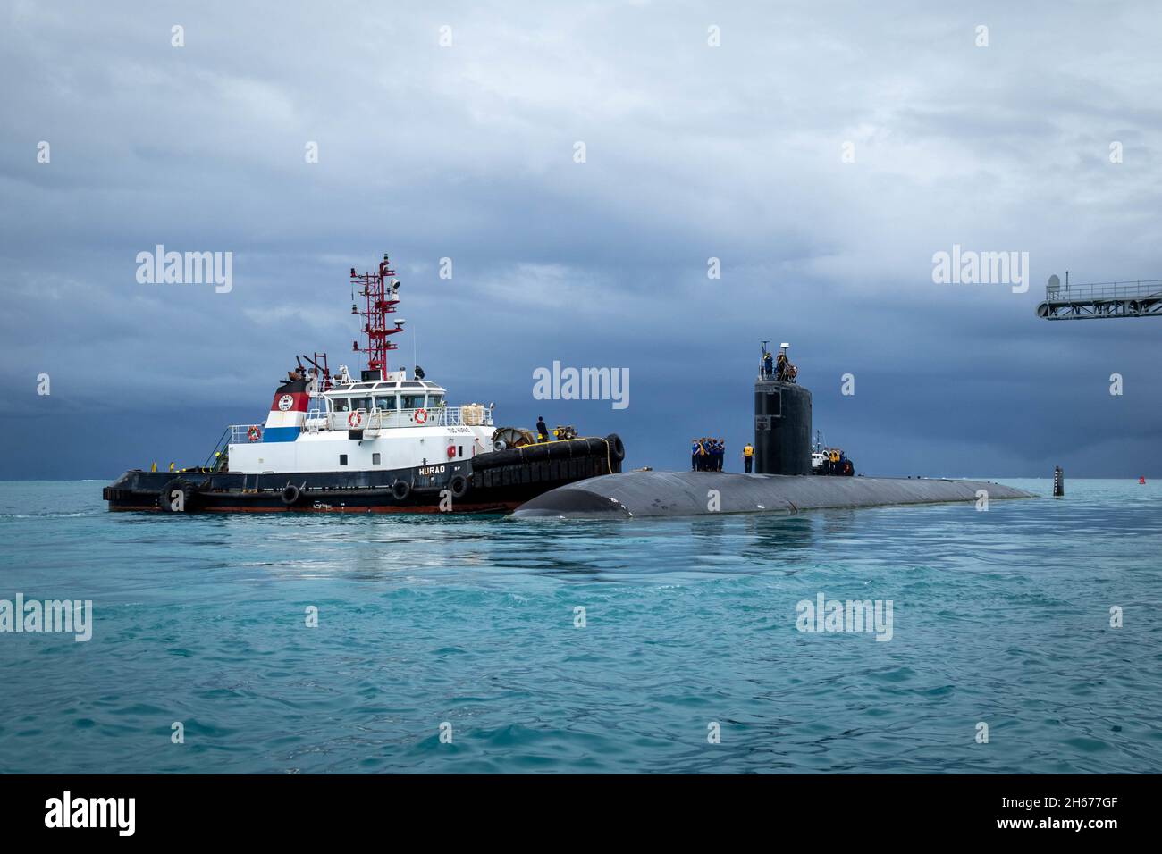 Saipan, Northern Mariana Islands. 23 October, 2021. The U.S. Navy Los Angeles-class fast attack submarine USS Hampton departs after resupplying from the submarine tender USS Frank Cable October 23, 2021 in Saipan, Northern Mariana Islands. Credit: MC1 Jonathan Trejo/U.S. Navy/Alamy Live News Stock Photo