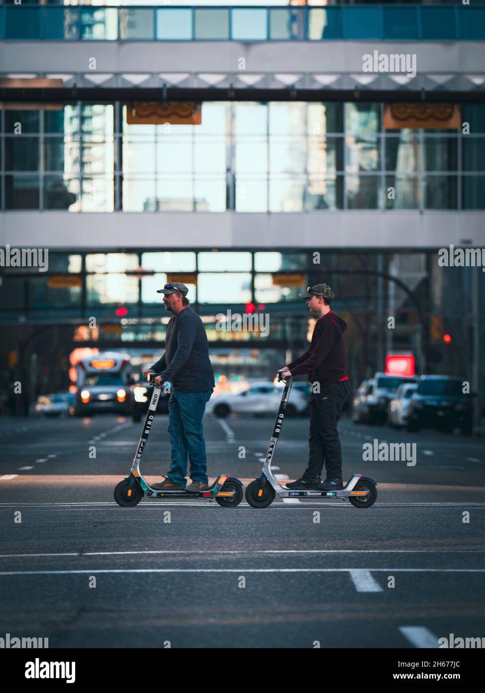 CALGARY, CANADA Oct 16, 2021 A ather and son cross the street on