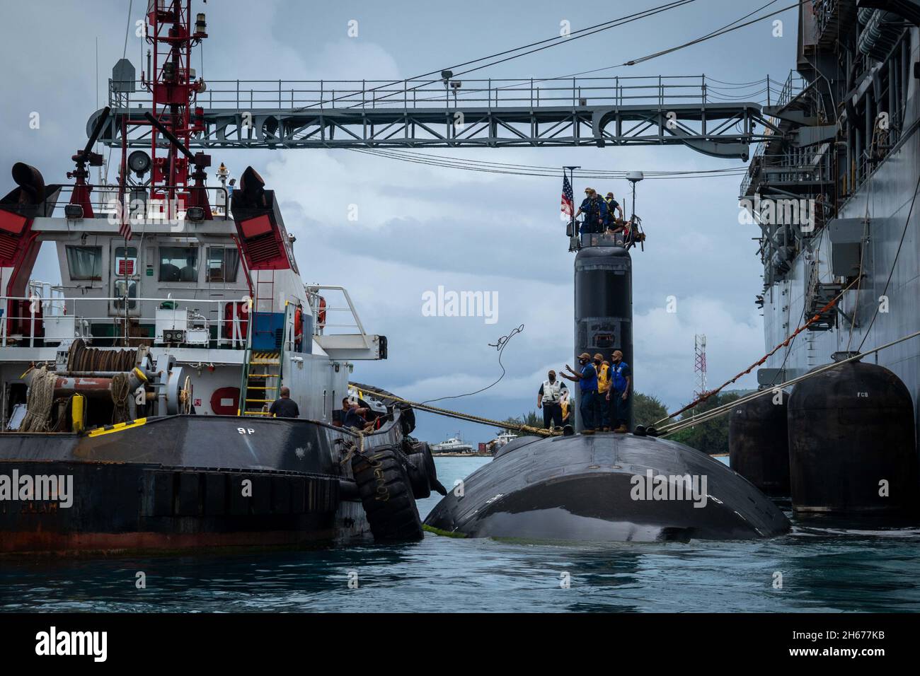 Saipan, Northern Mariana Islands. 23 October, 2021. The U.S. Navy Los Angeles-class fast attack submarine USS Hampton departs after resupplying from the submarine tender USS Frank Cable October 23, 2021 in Saipan, Northern Mariana Islands. Credit: MC1 Jonathan Trejo/U.S. Navy/Alamy Live News Stock Photo