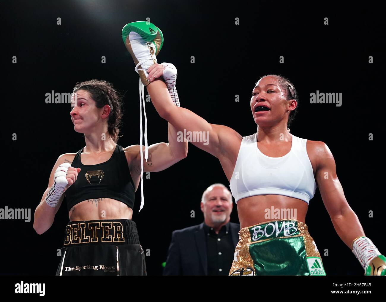 Alycia Baumgardner (right) celebrates victory by knockout against Terri