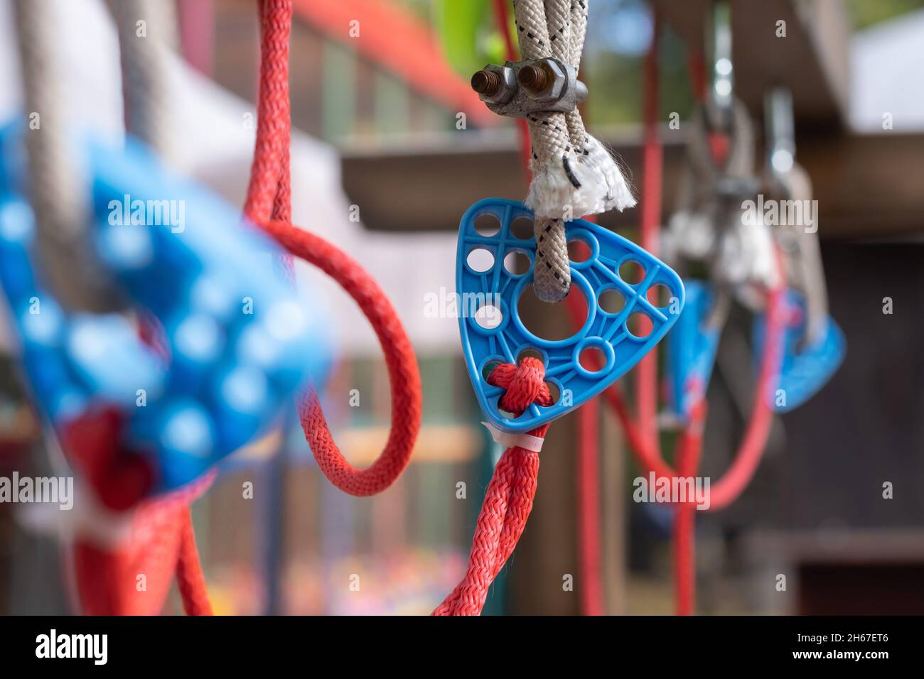 Plastic adapter for connecting ropes, friction element for a children's swing. Safe rope connection for sports equipment. Stock Photo