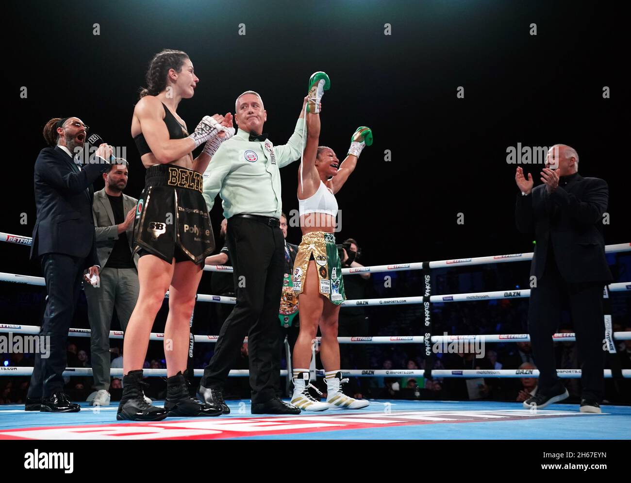 Alycia Baumgardner (right) celebrates victory by knockout against Terri Harper (left) in the World Boxing Council World Female Super Feather Title bout at Sheffield Arena. Picture date: Saturday November 13, 2021. Stock Photo