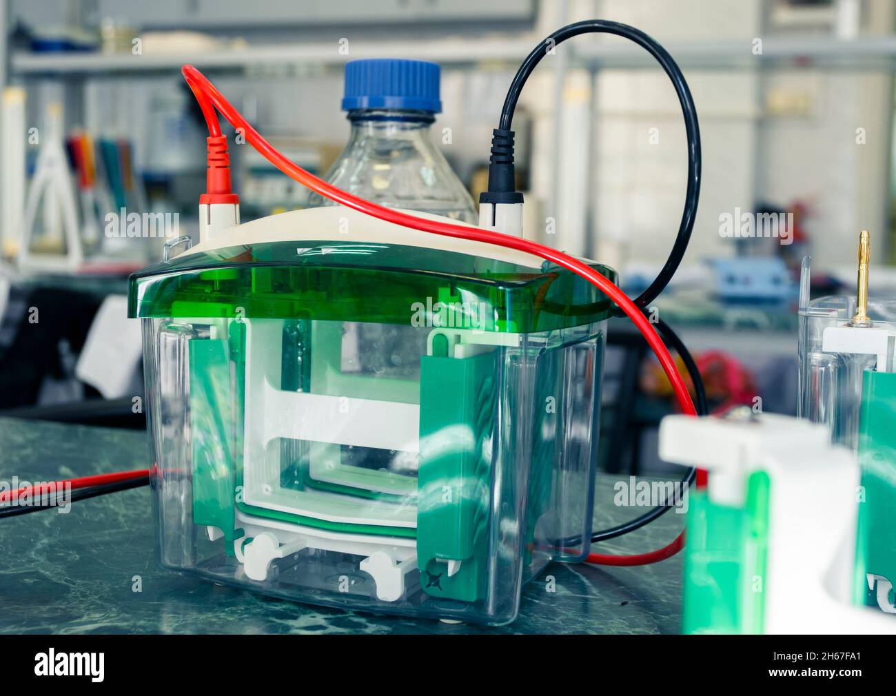 Scientific, medical device with wires on the desktop in the laboratory, vertical electrophoresis
