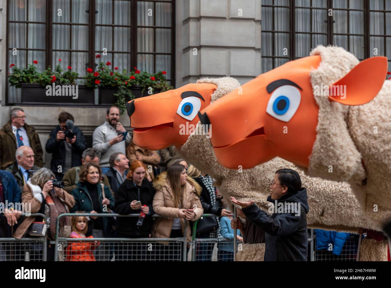Worshipful Company of Woolmen at the Lord Mayor's Show, Parade, procession passing along Poultry, near Mansion House, London, UK. Giant sheep effigies Stock Photo