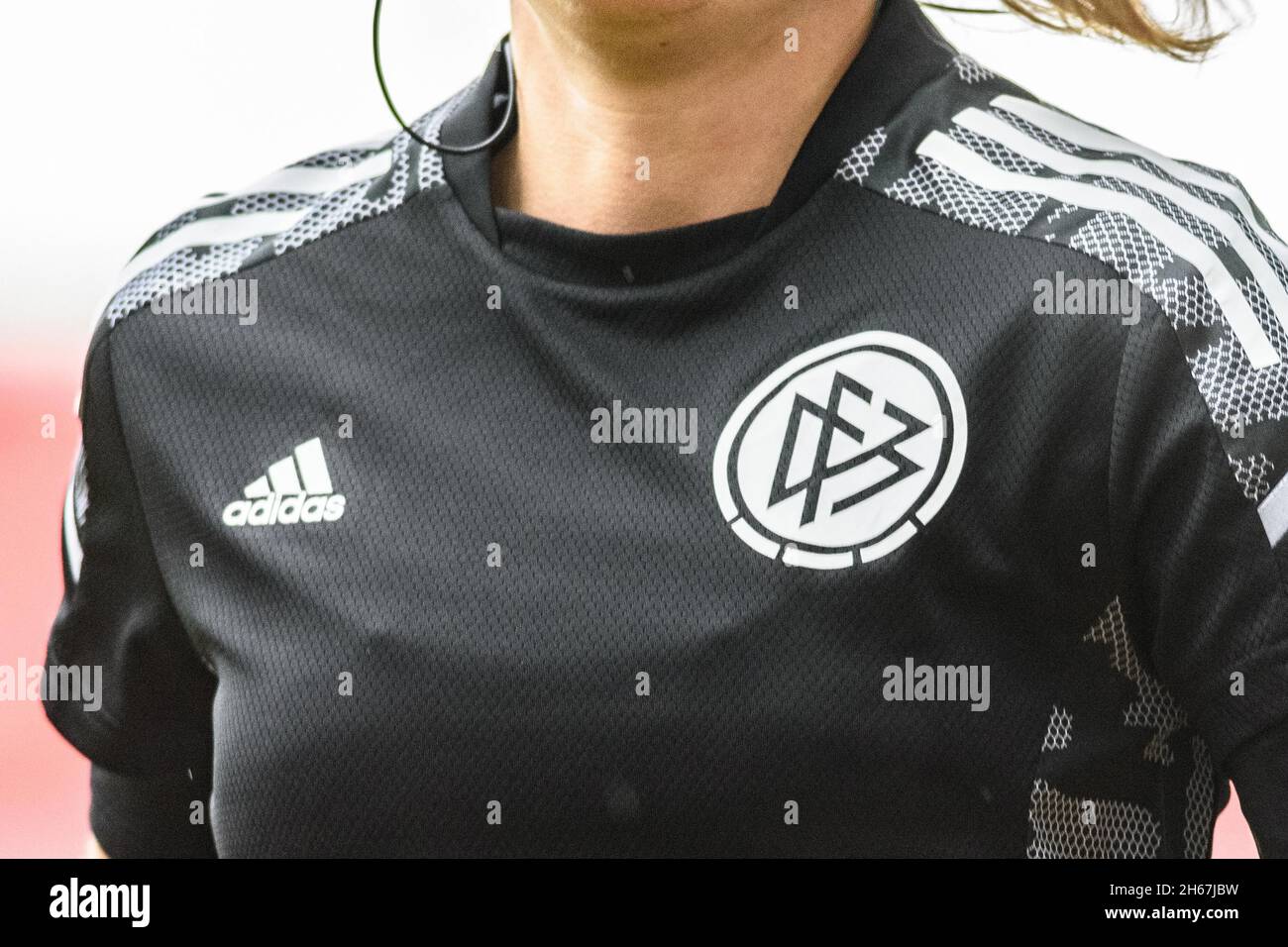 Munich, Germany, Nov 13th 2021: Close-up of referee in DFB Adidas shirt  warming up during the Flyeralarm Frauen Bundesliga match between FC Bayern  Munich and VfL Wolfsburg at FC Bayern Campus, Munich.