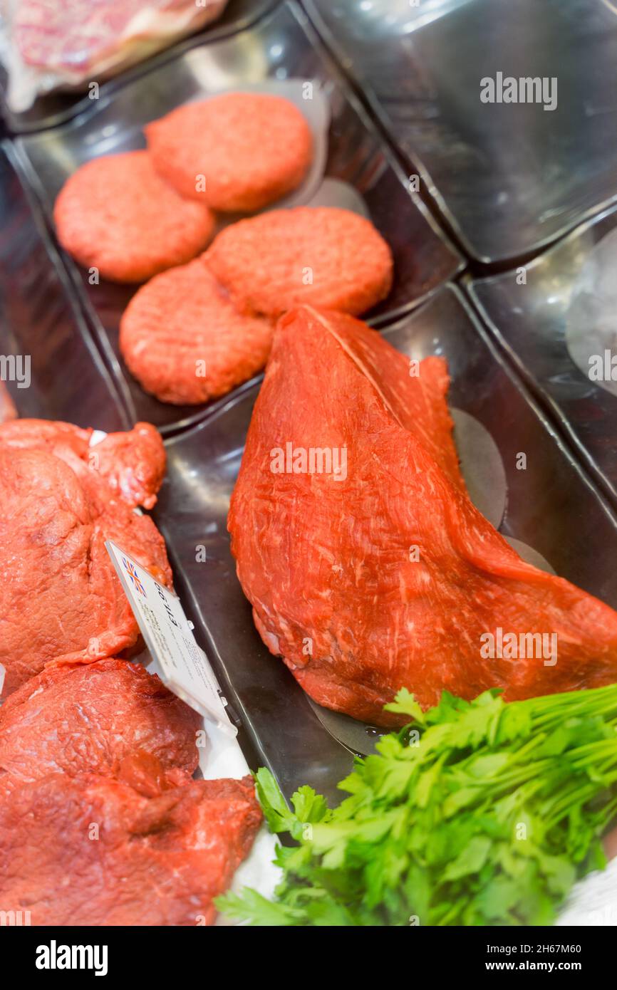 raw and uncooked beef burger and lean beef steaks Stock Photo Alamy