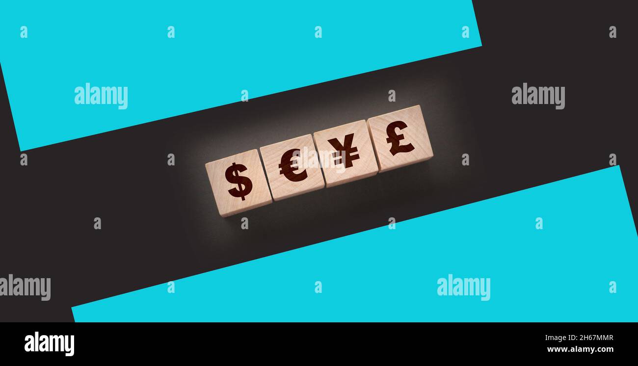 Dillar, euro, yen and pound on building blocks. wooden cubes with