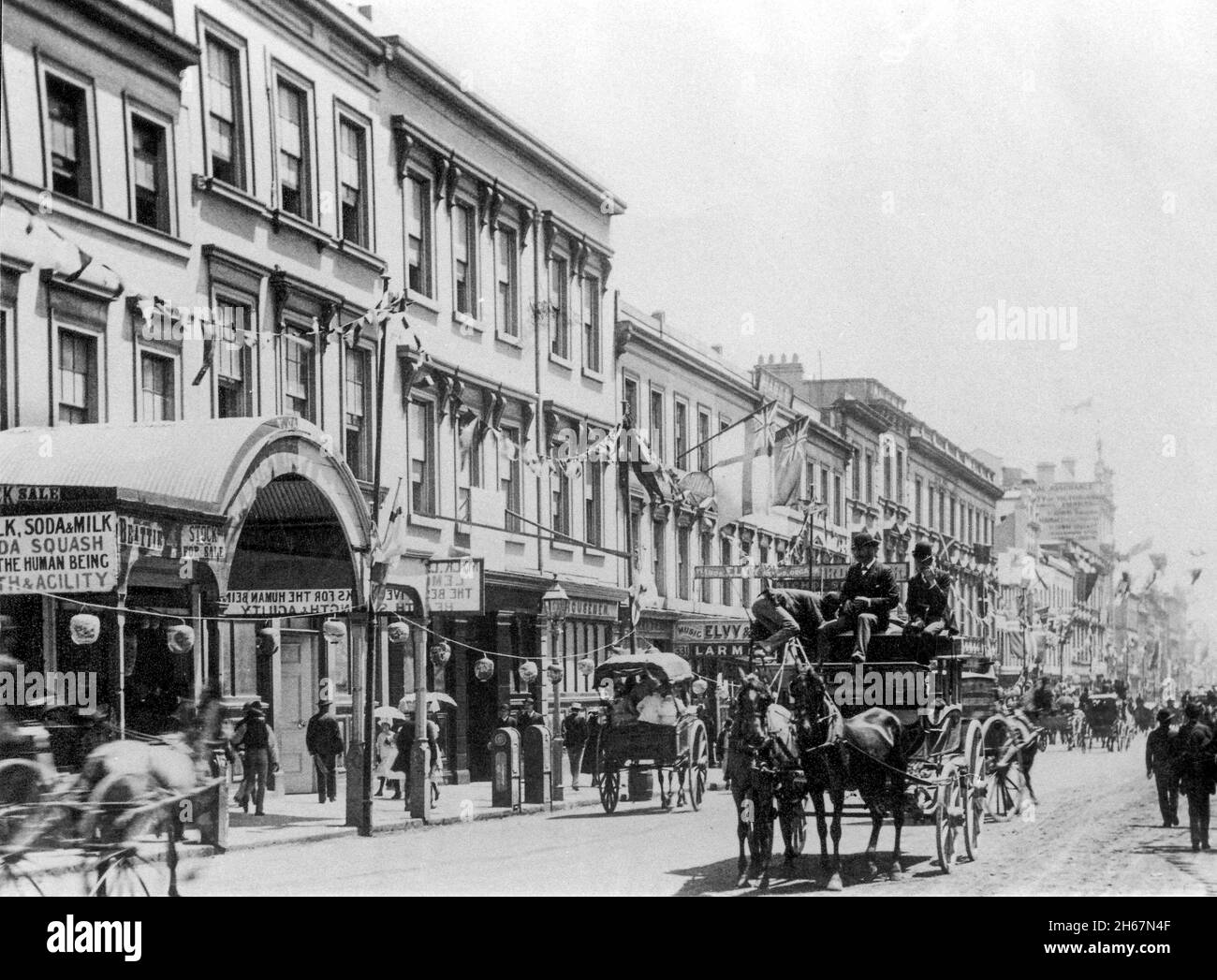 Historical Sydney in  1879 showing George street and the transport of the day the   horse and carriage. Stock Photo