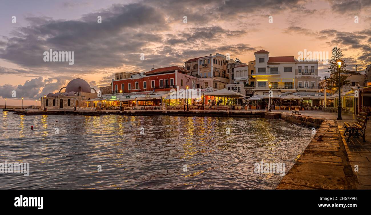 the old venetian harbour in Chania at the first morning light with reflections in the sea, Crete, Greece, October 13, 2021 Stock Photo