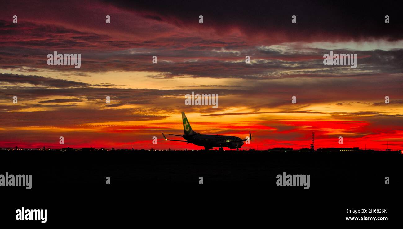 Transavia Airplane ready for depature at dusk in Faro International Airport. Algarve, Portugal Stock Photo