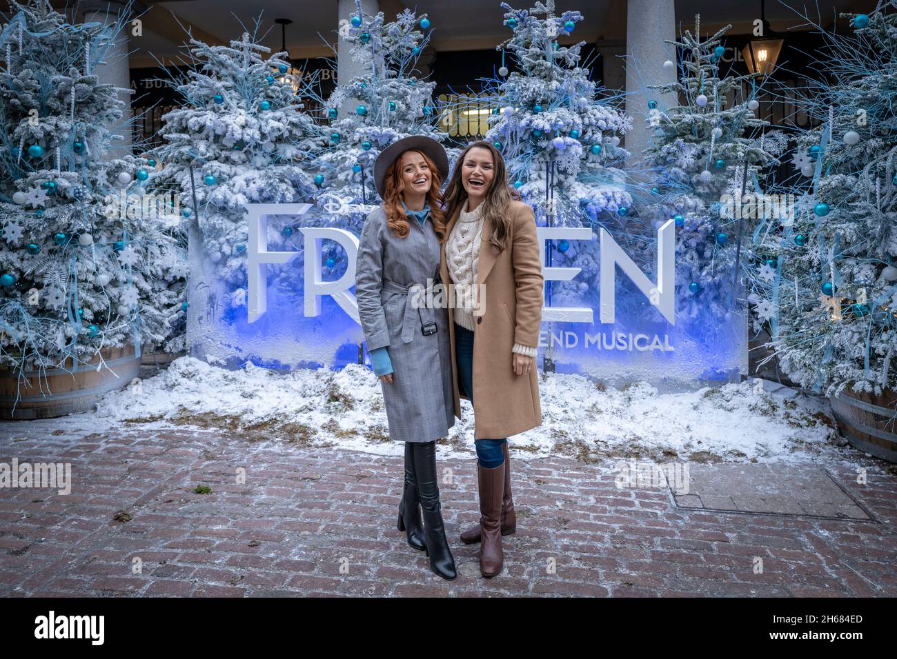 Cast of Disney theatre production: ‘Frozen: The Musical’, including Stephanie McKeon(L) as Anna and Samantha Barks(R) as Elsa gather in Covent Garden. Stock Photo