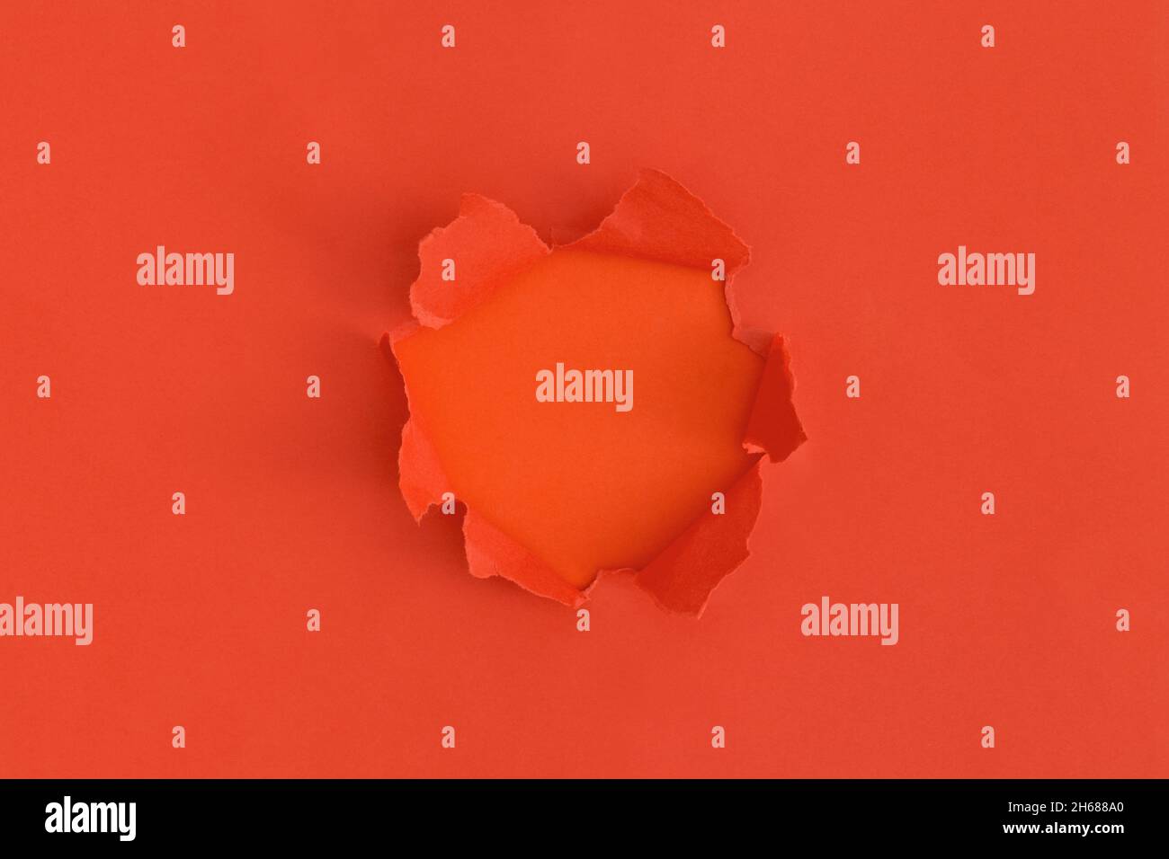 Red torn paper with space for text with red background Stock Photo