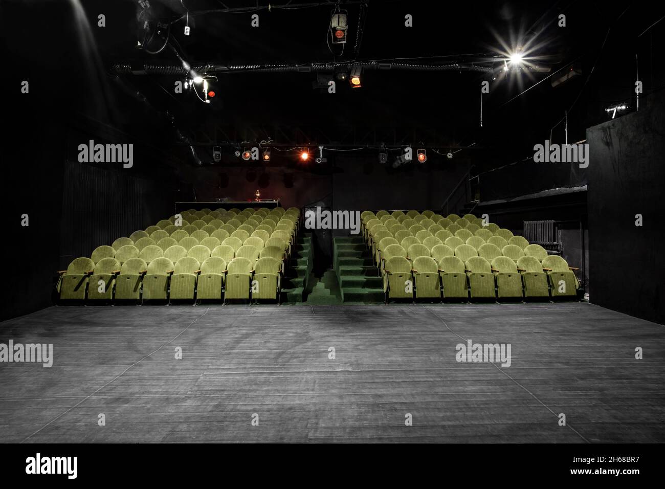 mage of a small auditorium with green armchairs Stock Photo