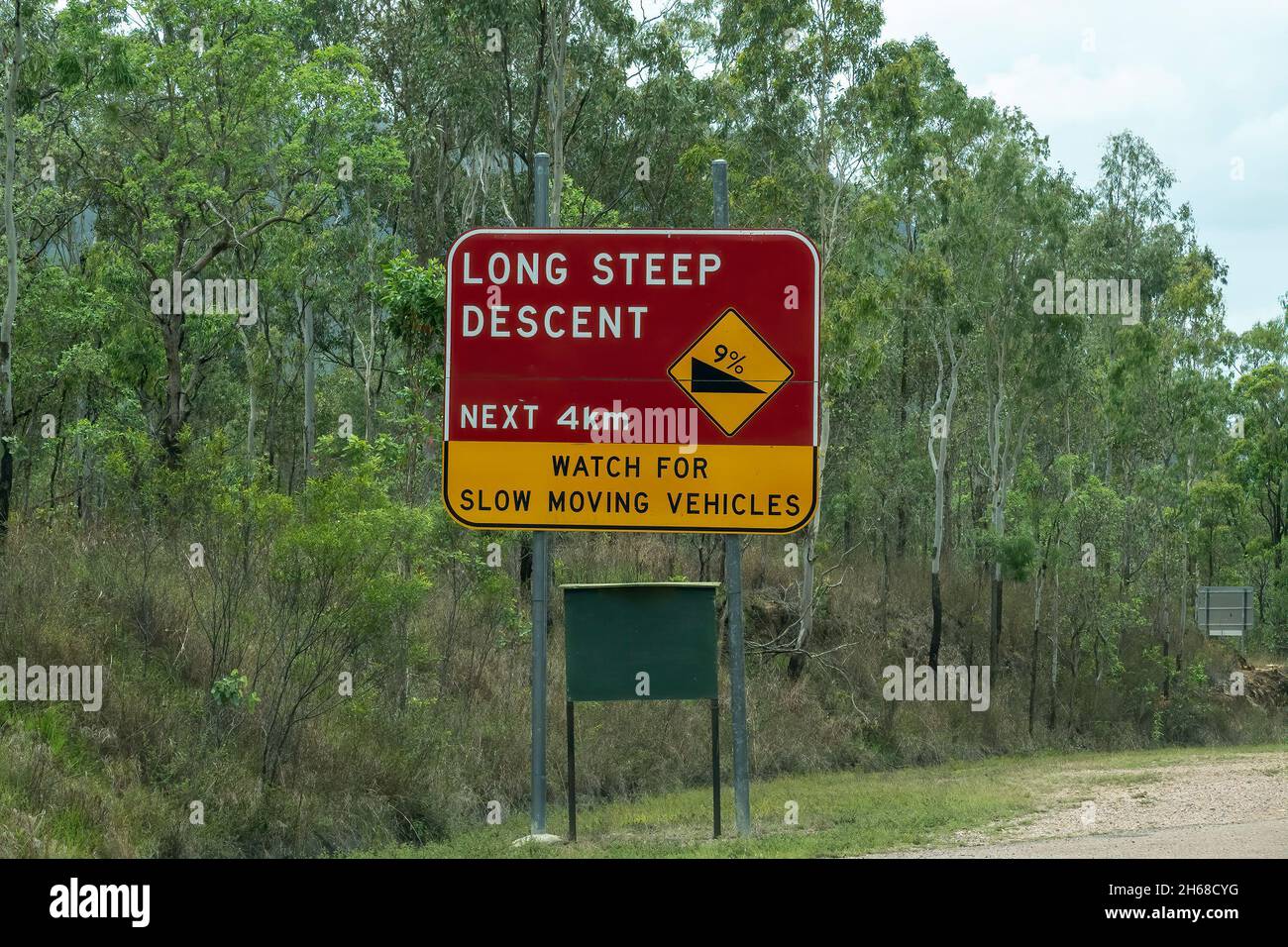 road-sign-warning-of-long-steep-descent-ahead-and-to-watch-for-slow