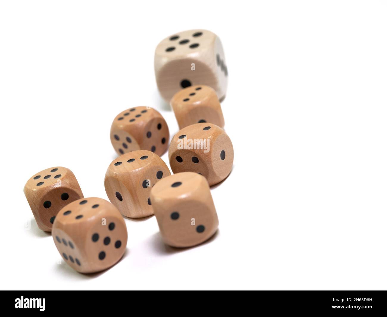 Wooden game dice against a white background Stock Photo