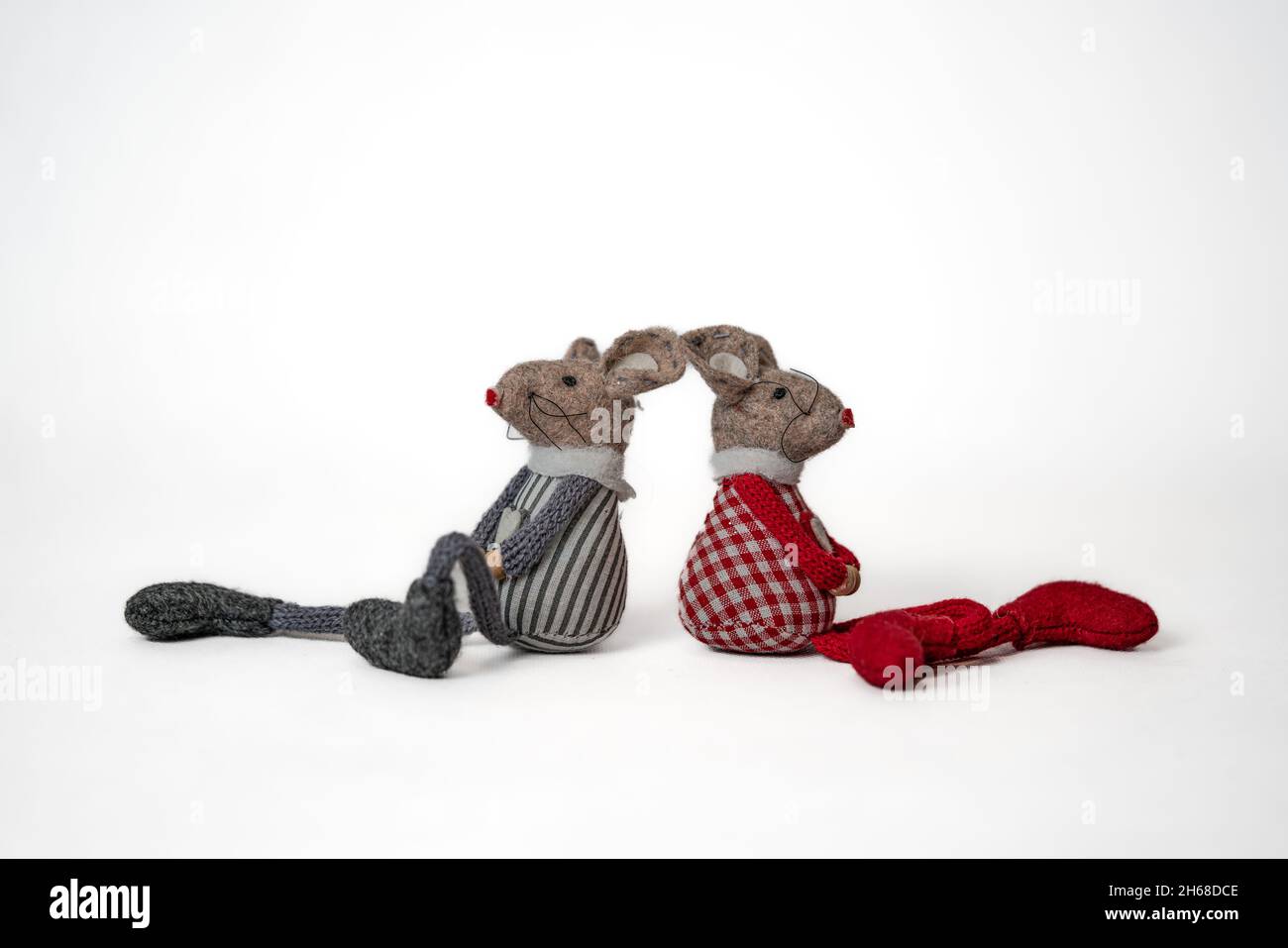 two toy mice sit back to back isolated at white background Stock Photo