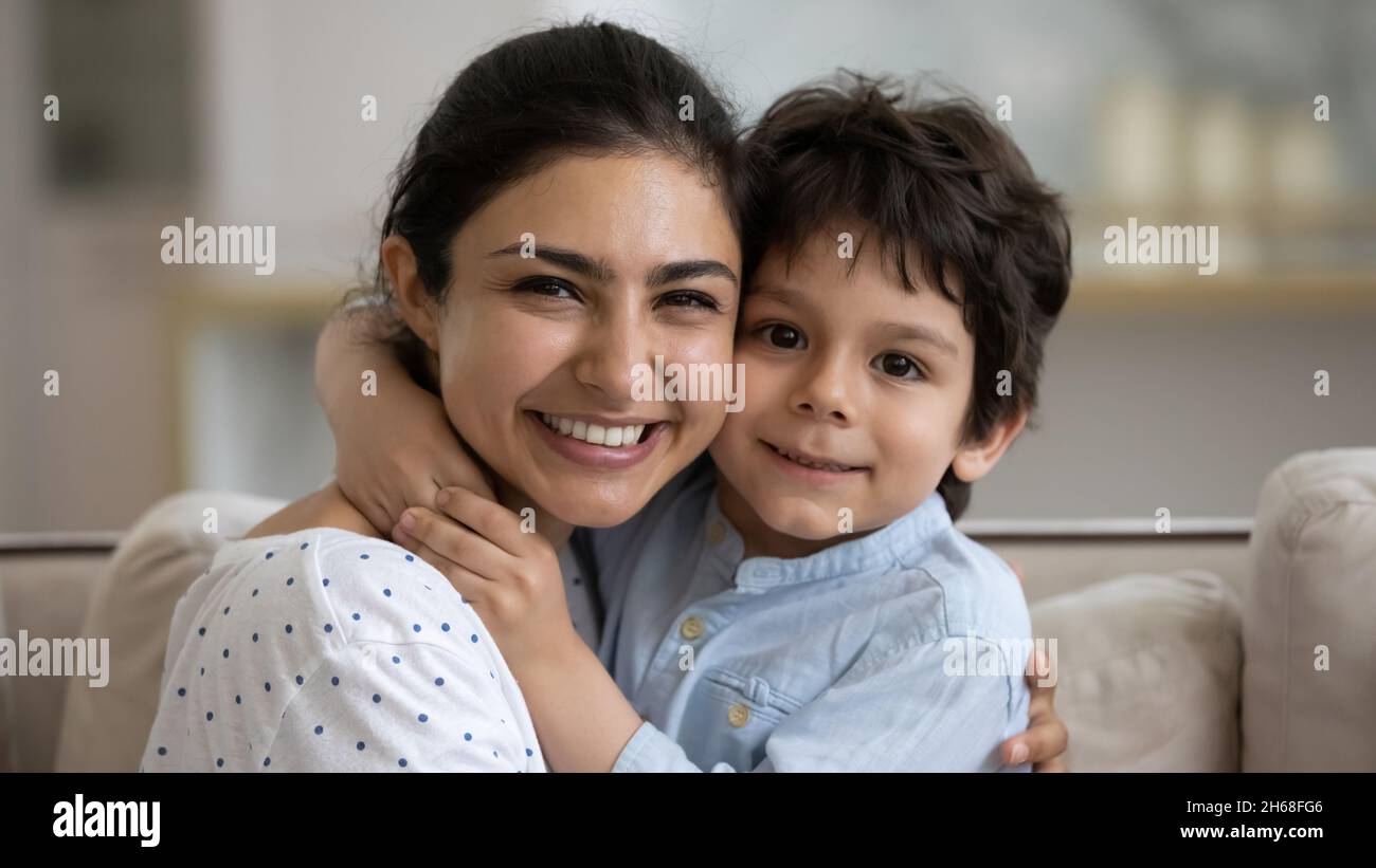 Happy Indian mom hugging little smiling son with cheek touch Stock Photo -  Alamy