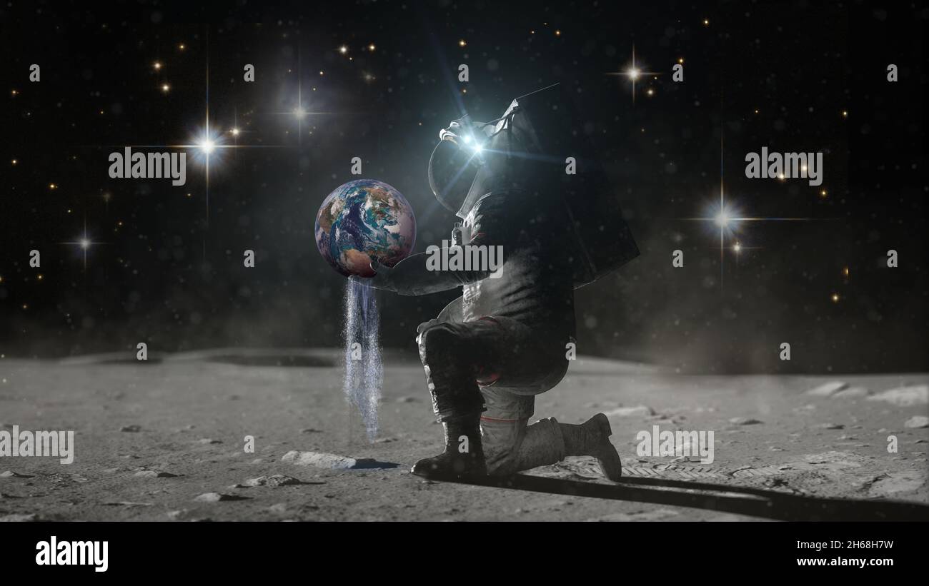 Astronaut sits on his knee on lunar surface holds planer Earth in hands and pours earth's water through his fingers. Water day concept. Water as a tre Stock Photo