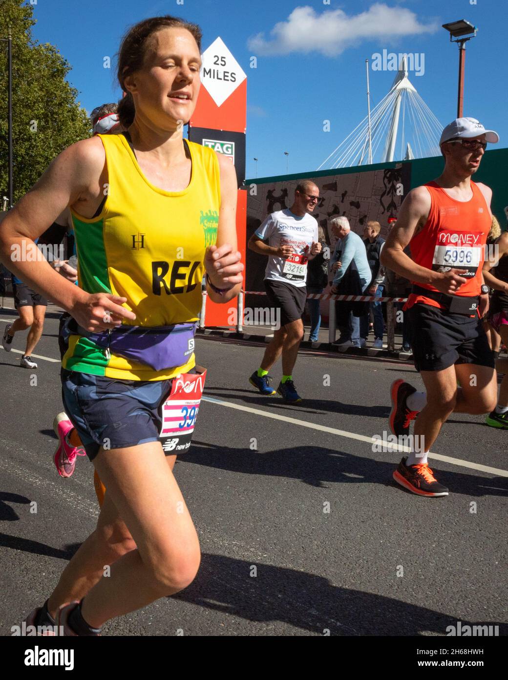Woman running, Virgin Money London Marathon 2021 at the 25 mile point, Victoria Embankment. Stock Photo