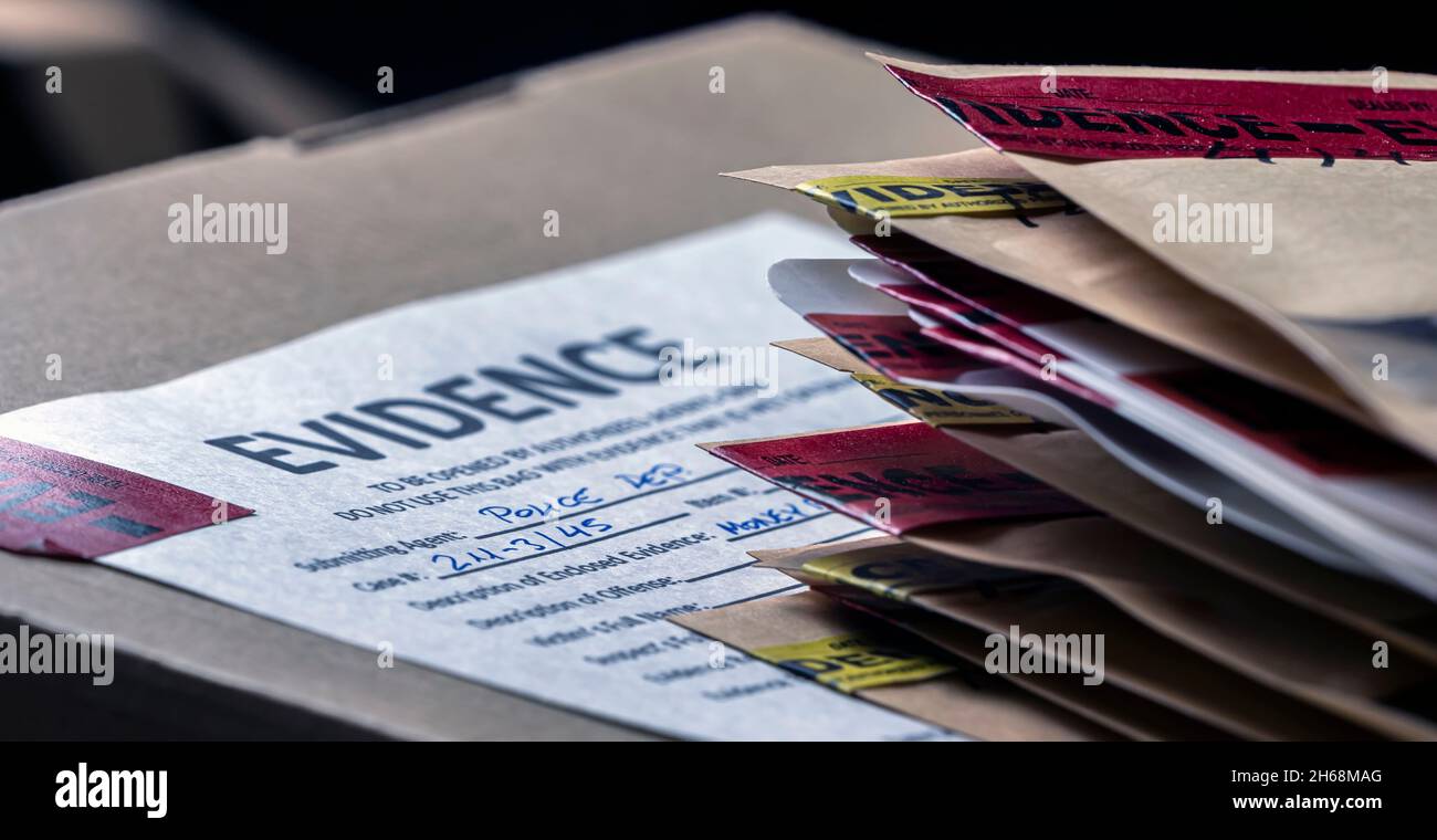 Files and evidence bag in a crime lab, conceptual image Stock Photo