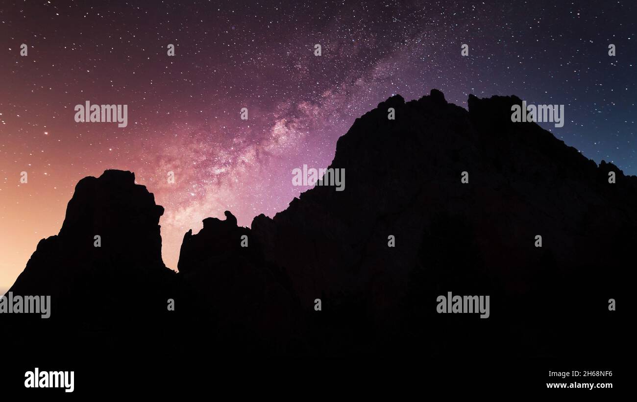 A wonderful milky way galaxy seen behind the rocky hills Stock Photo ...