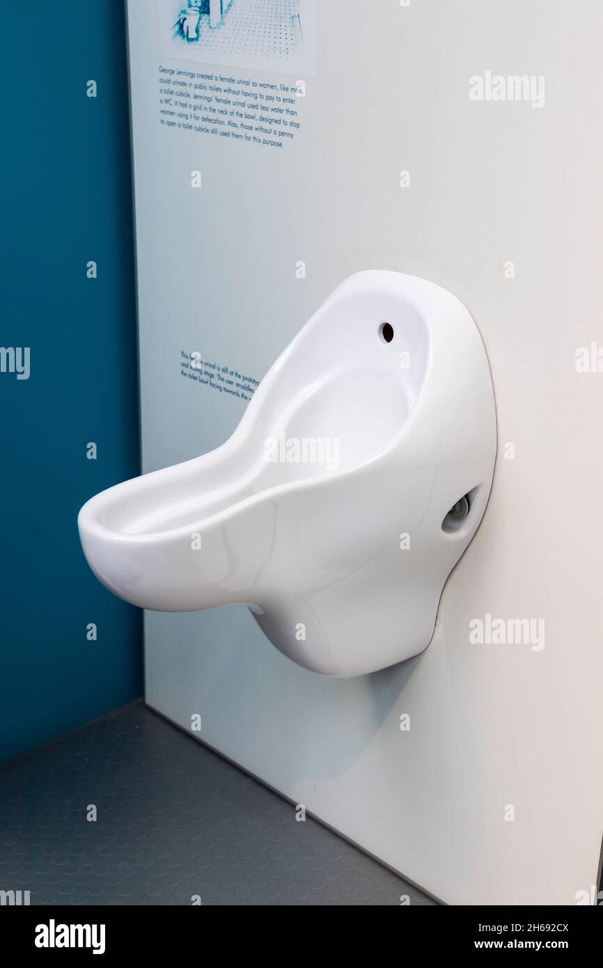 white ceramic female womens urinal in flushed with pride toilet