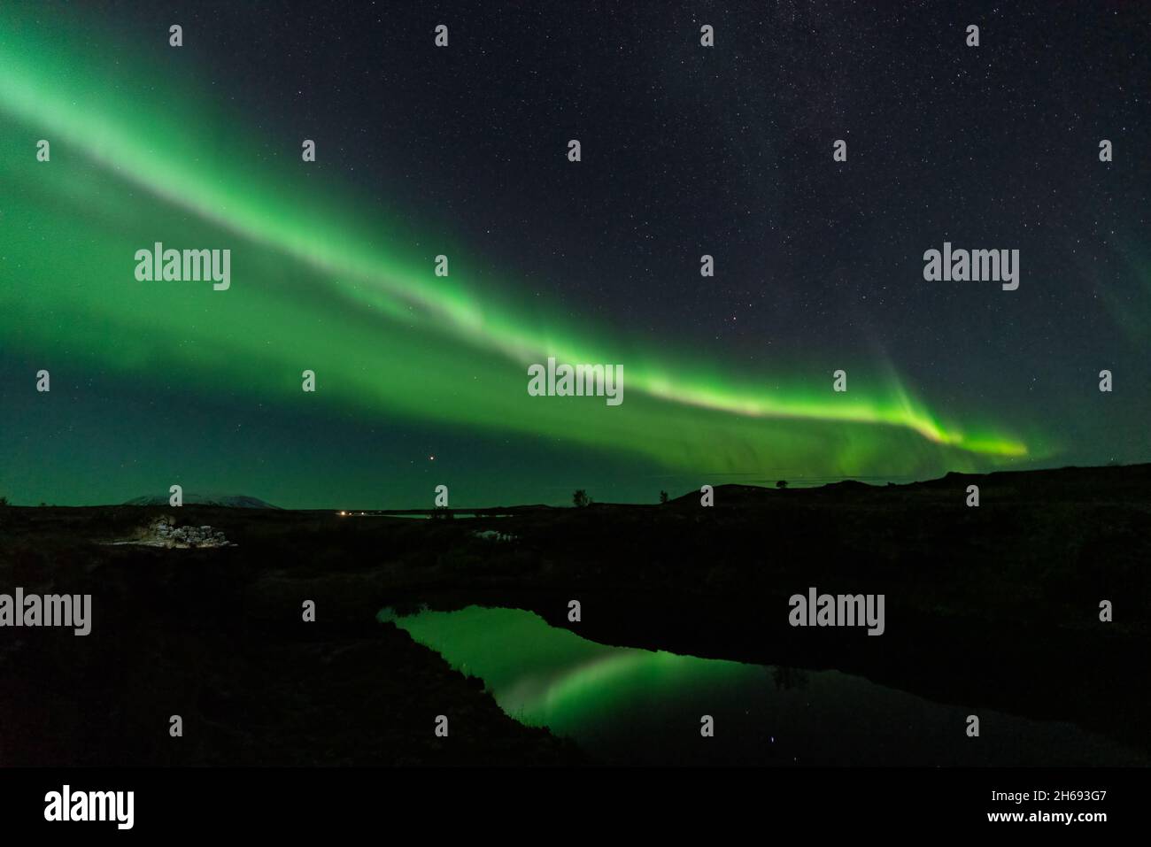 Aurora borealis lights reflected over the lake Stock Photo - Alamy
