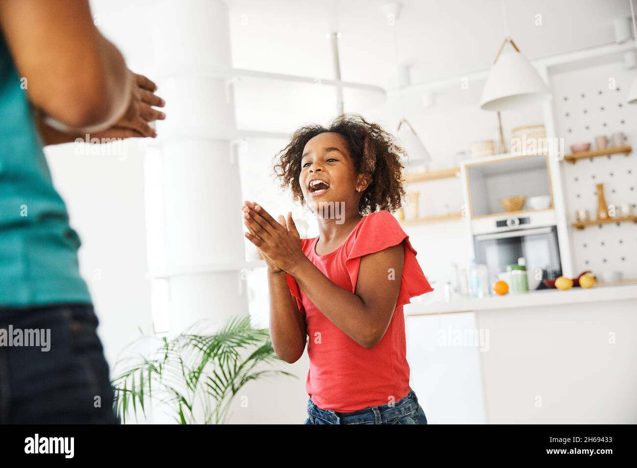 child daughter father family happy playing kid childhood dancing parent home woman girl bonding fun cheerful Stock Photo