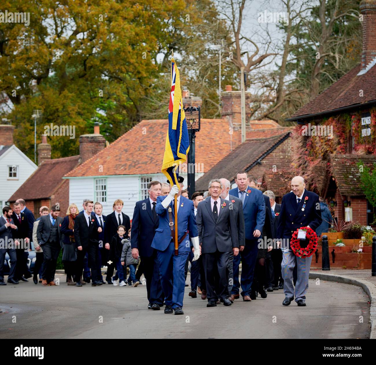 East Hoathly, UK. 14th Nov, 2021. East Hoathly villagers process to