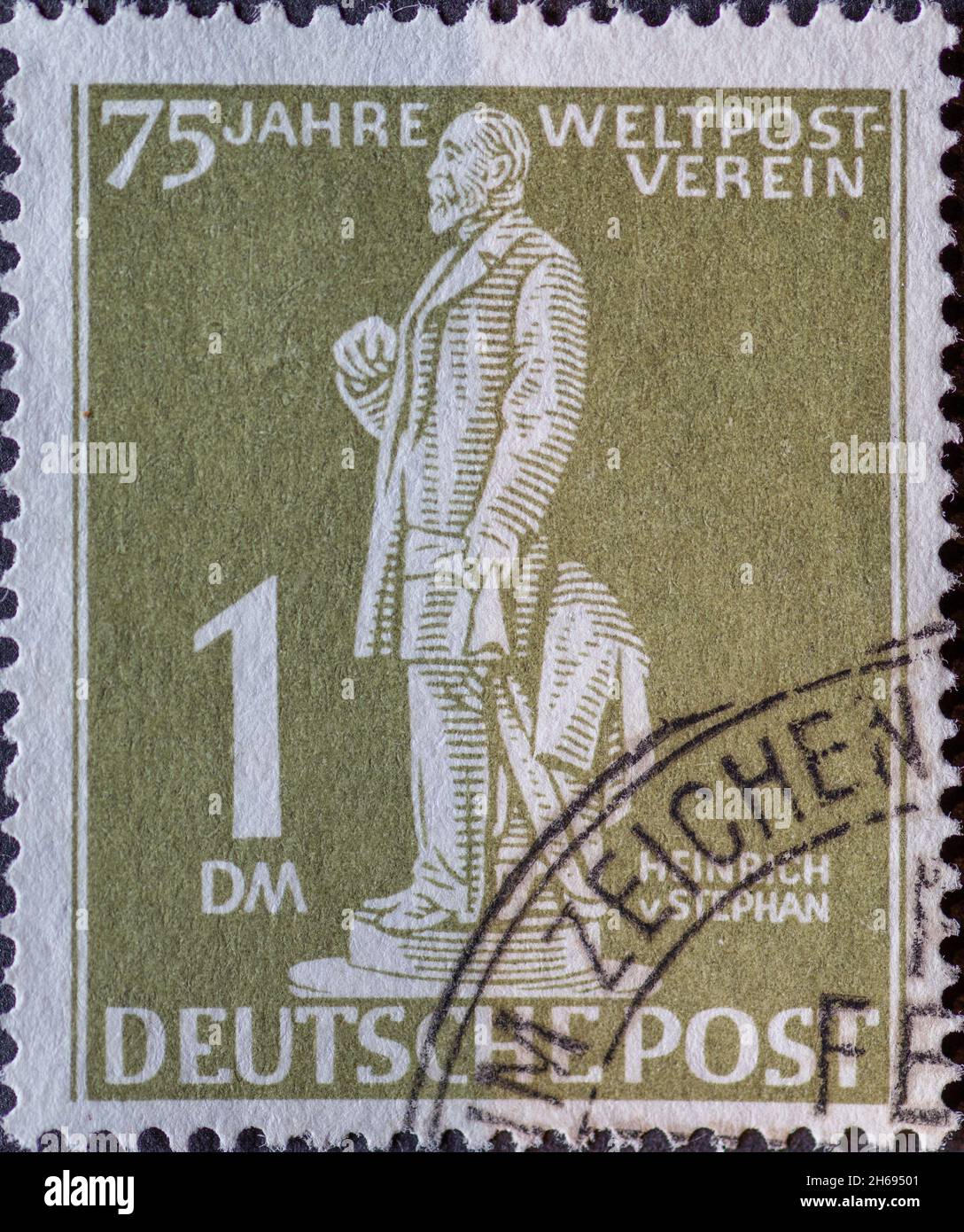 GERMANY, Berlin - CIRCA 1949: a postage stamp from Germany, Berlin in olive green color showing the Postmaster Heinrich von Stephan Text: 75 years of Stock Photo