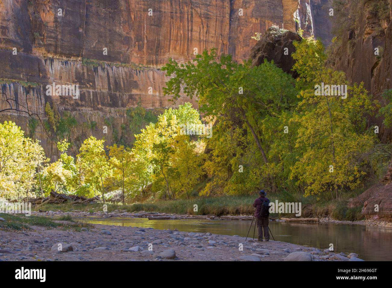 Zion National Park, Utah, USA. Photographer shooting from stony beach