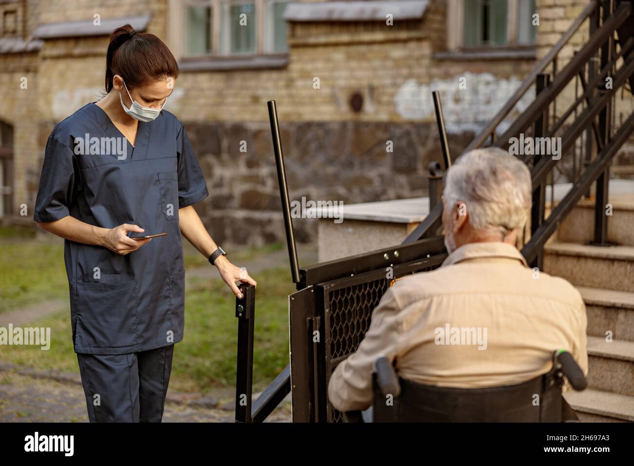 Woman wheelchair stairs hi-res stock photography and images - Alamy